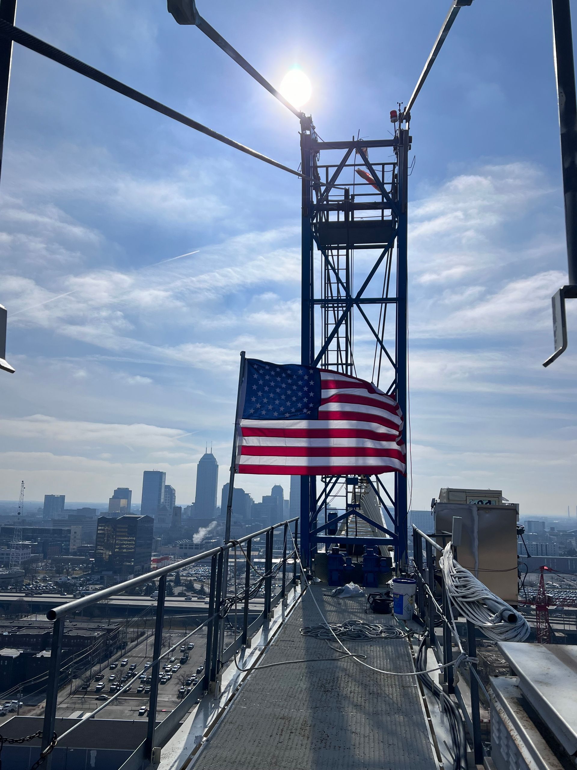 A large excavator is sitting on top of a wooden platform.