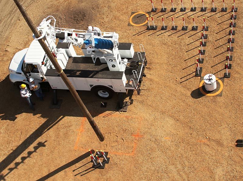 An aerial view of a construction site with a utility truck