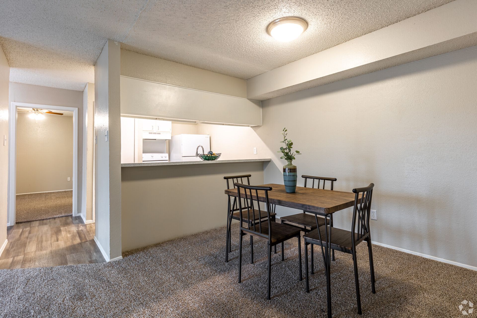 A dining room with a table and chairs in a house.