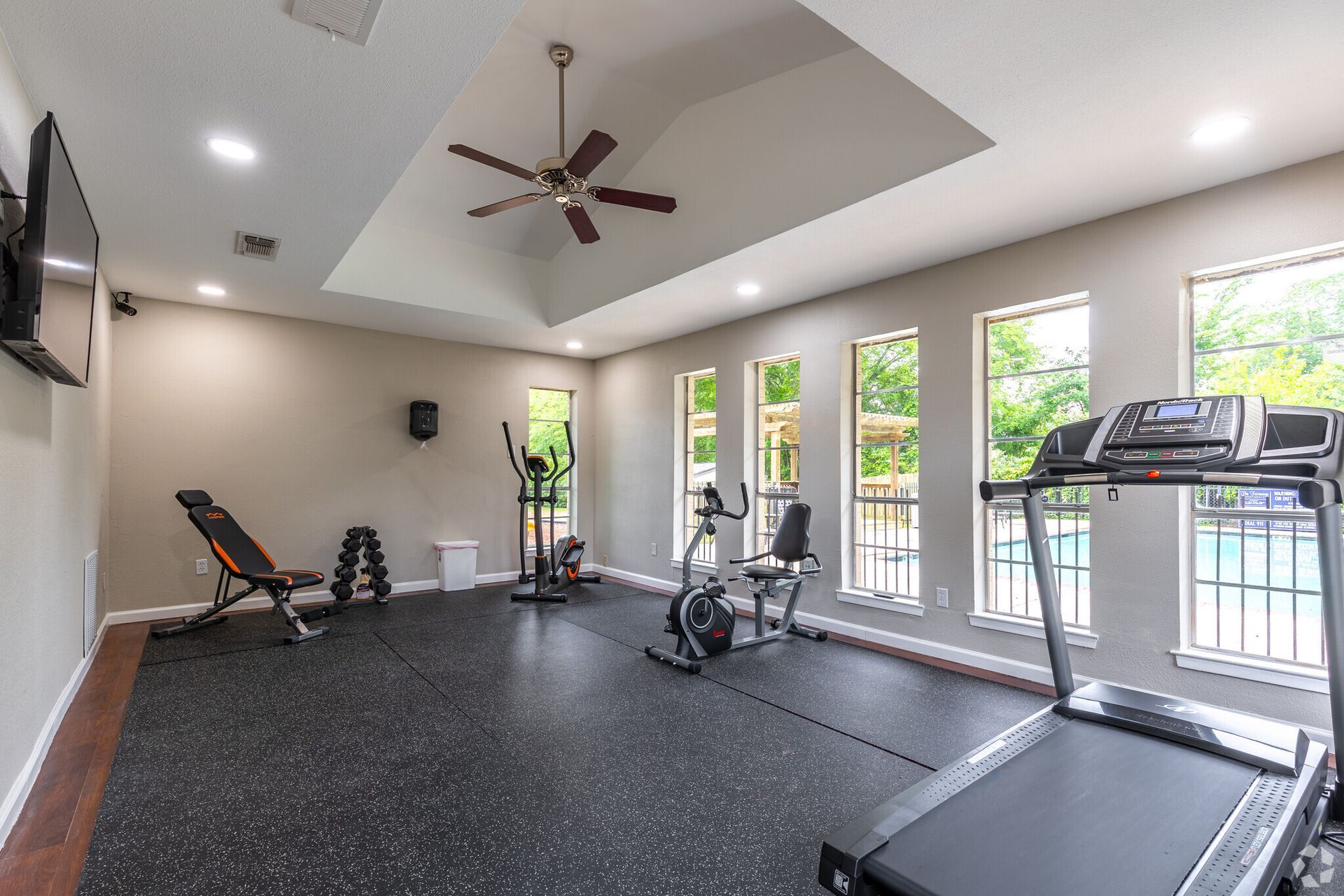 There is a treadmill in the middle of the room.