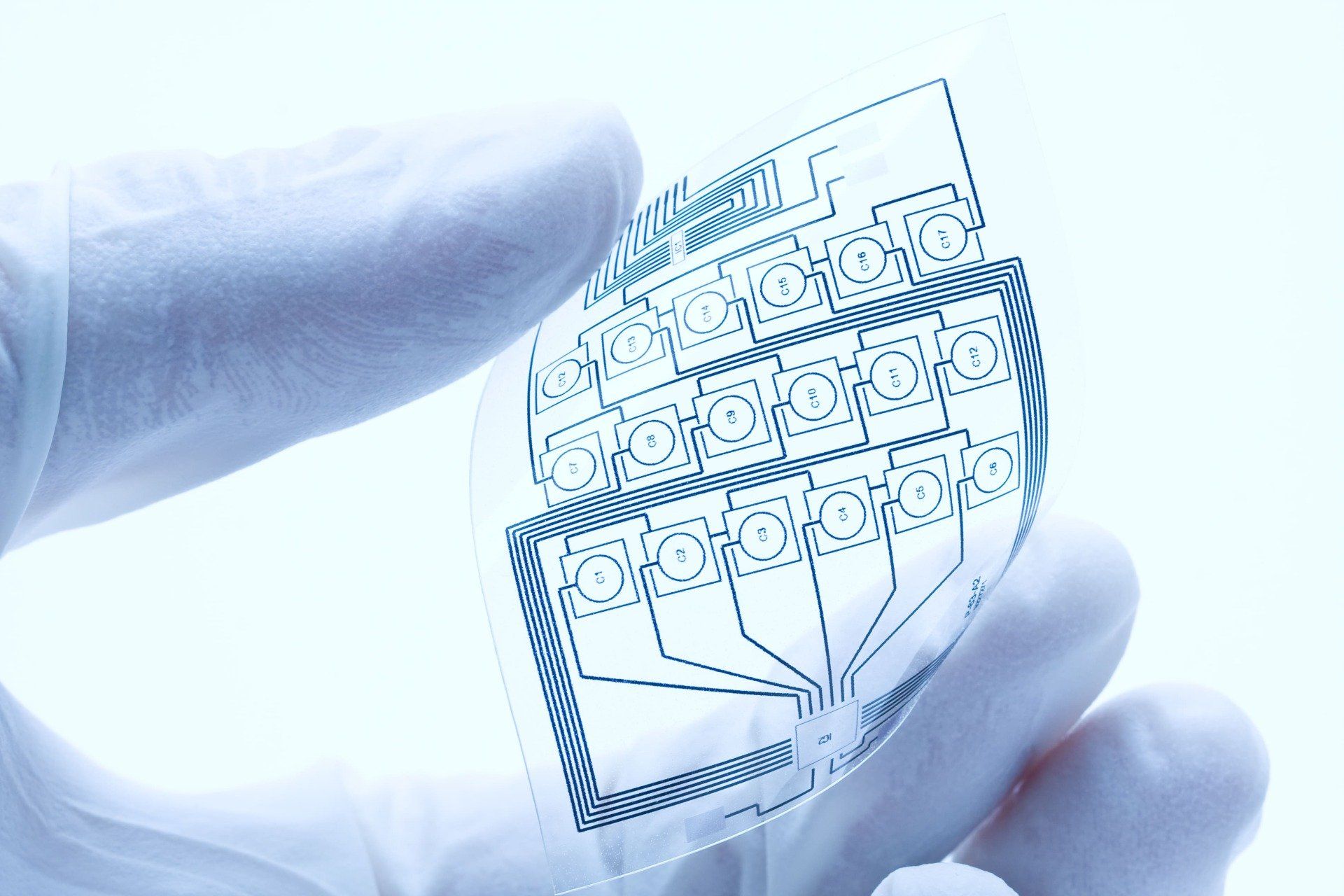 technician holding flexible printed circuit boards flexible printed circuit assemblies