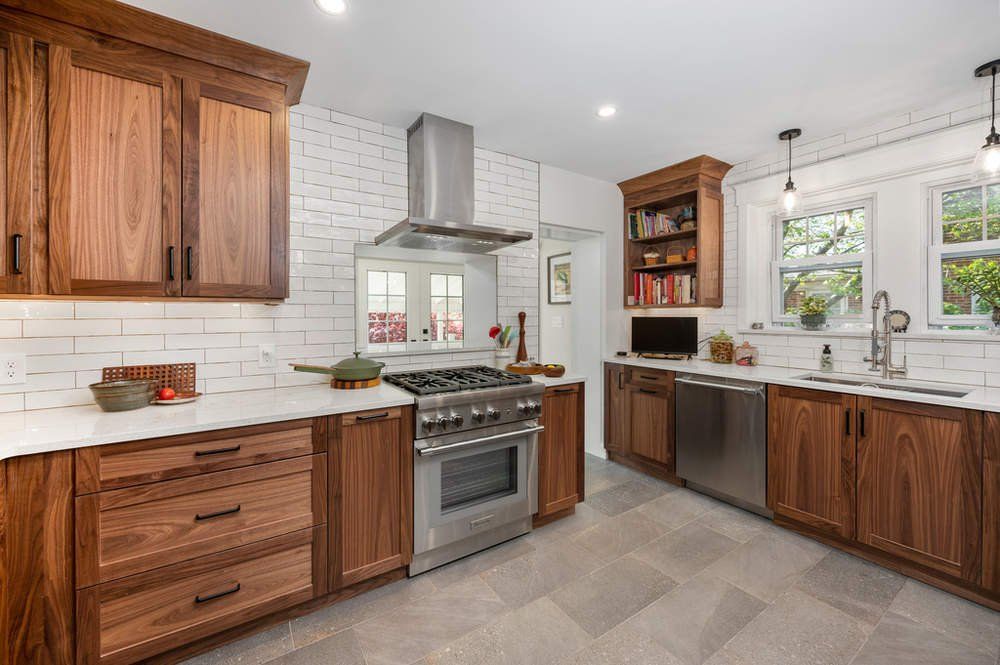A kitchen with wooden cabinets and stainless steel appliances.