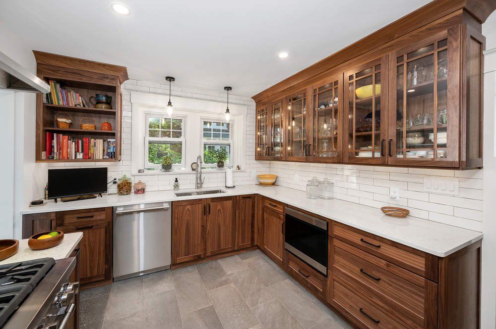 A kitchen with wooden cabinets and stainless steel appliances.