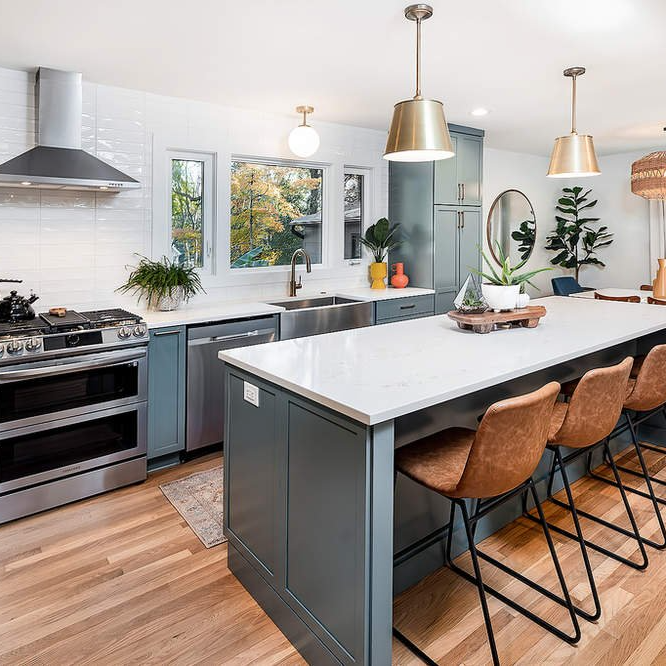 A kitchen with a large island and stools