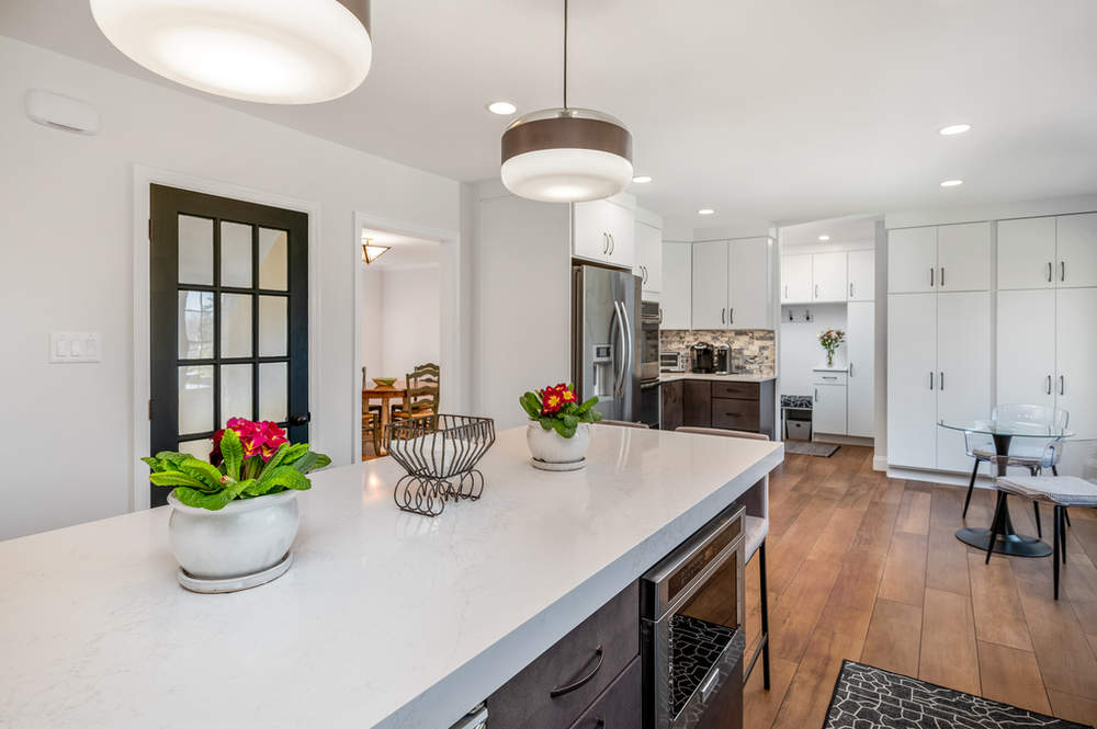 There is a large island in the middle of the kitchen.