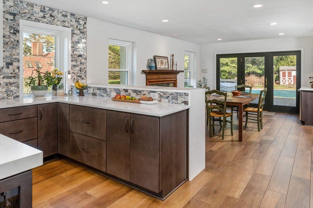 A kitchen with a table and chairs in it