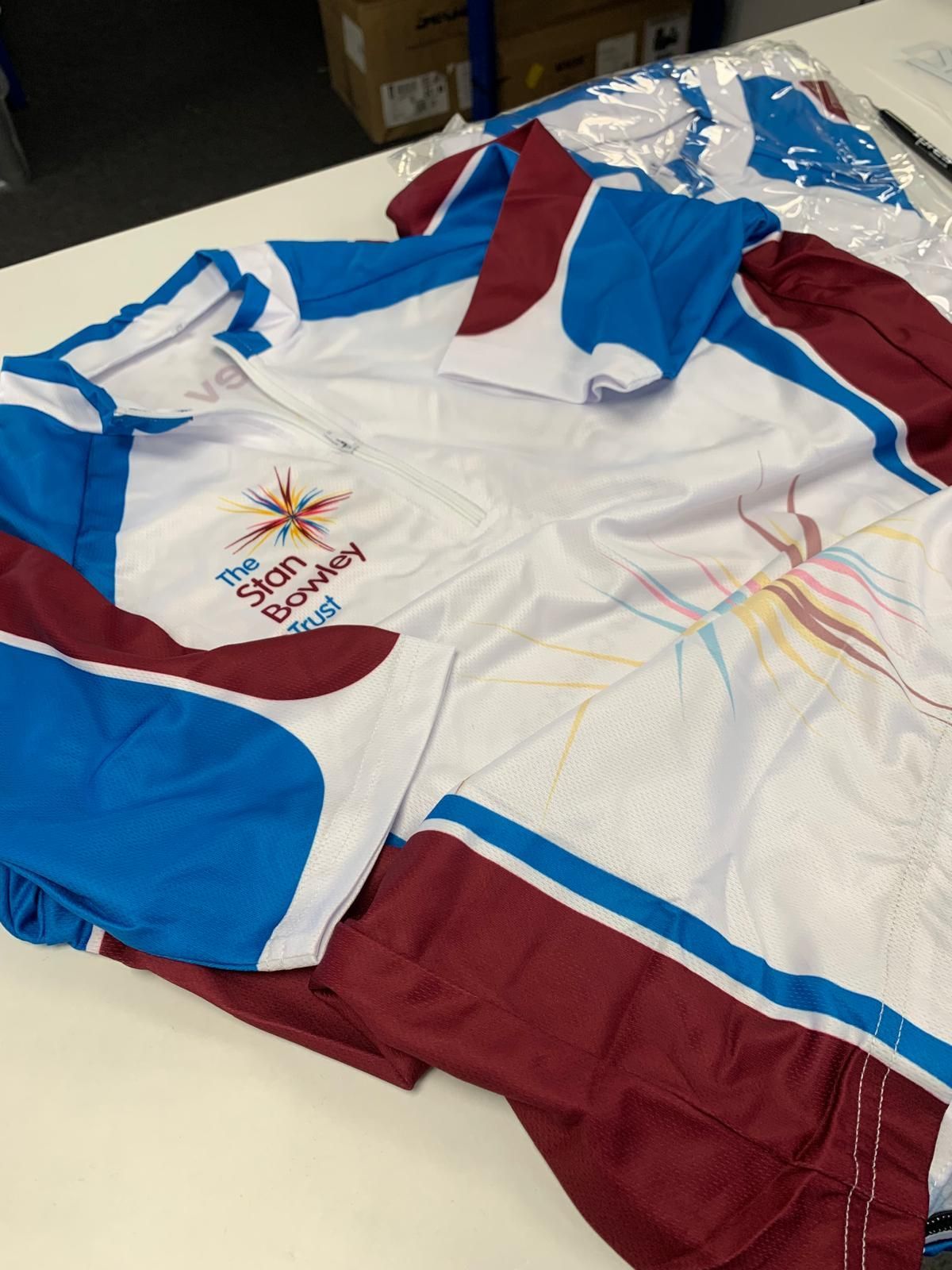 WhiteLodge Two sports shirts, white with blue and maroon accents, featuring