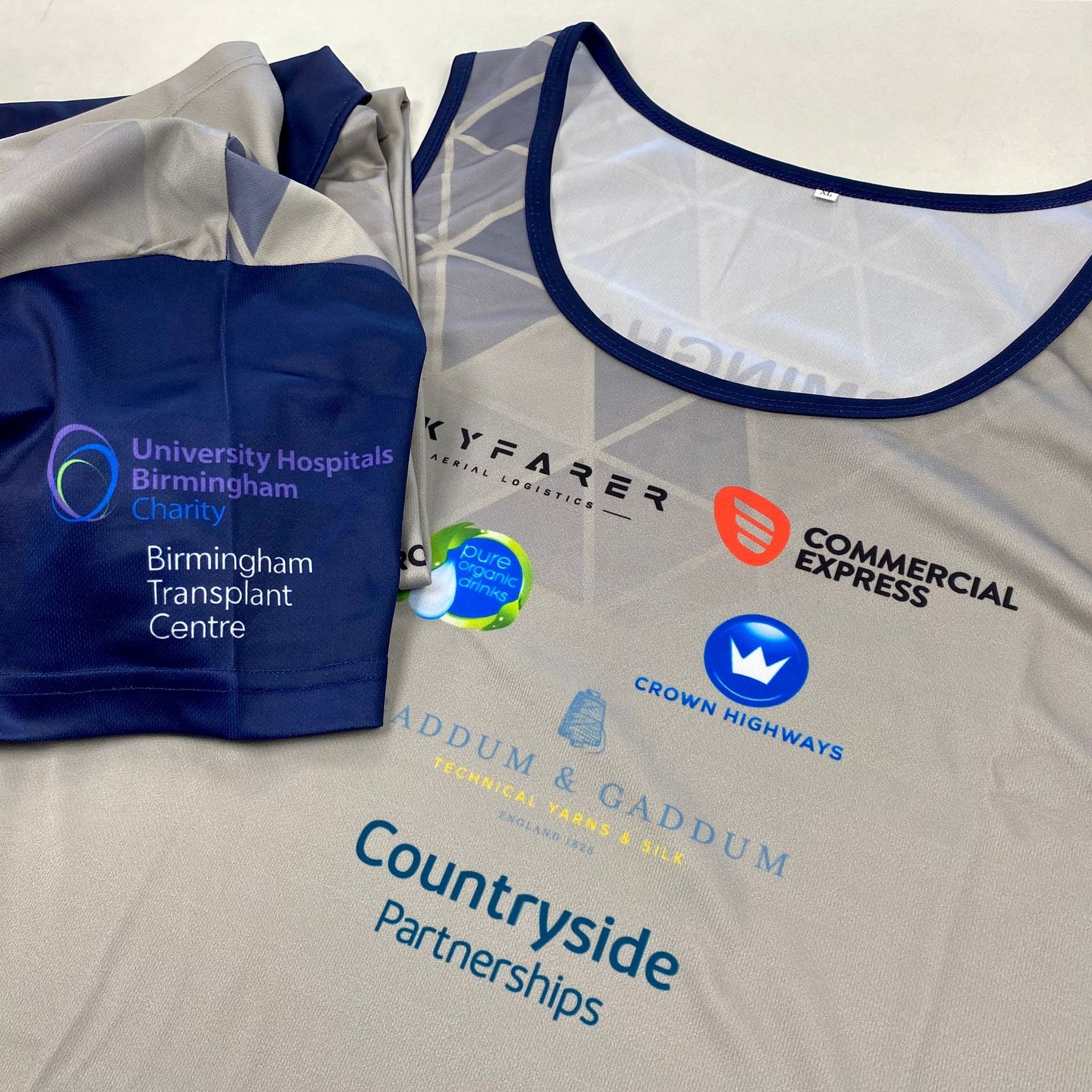 WhiteLodge A running vest and sleeve with sponsor logos