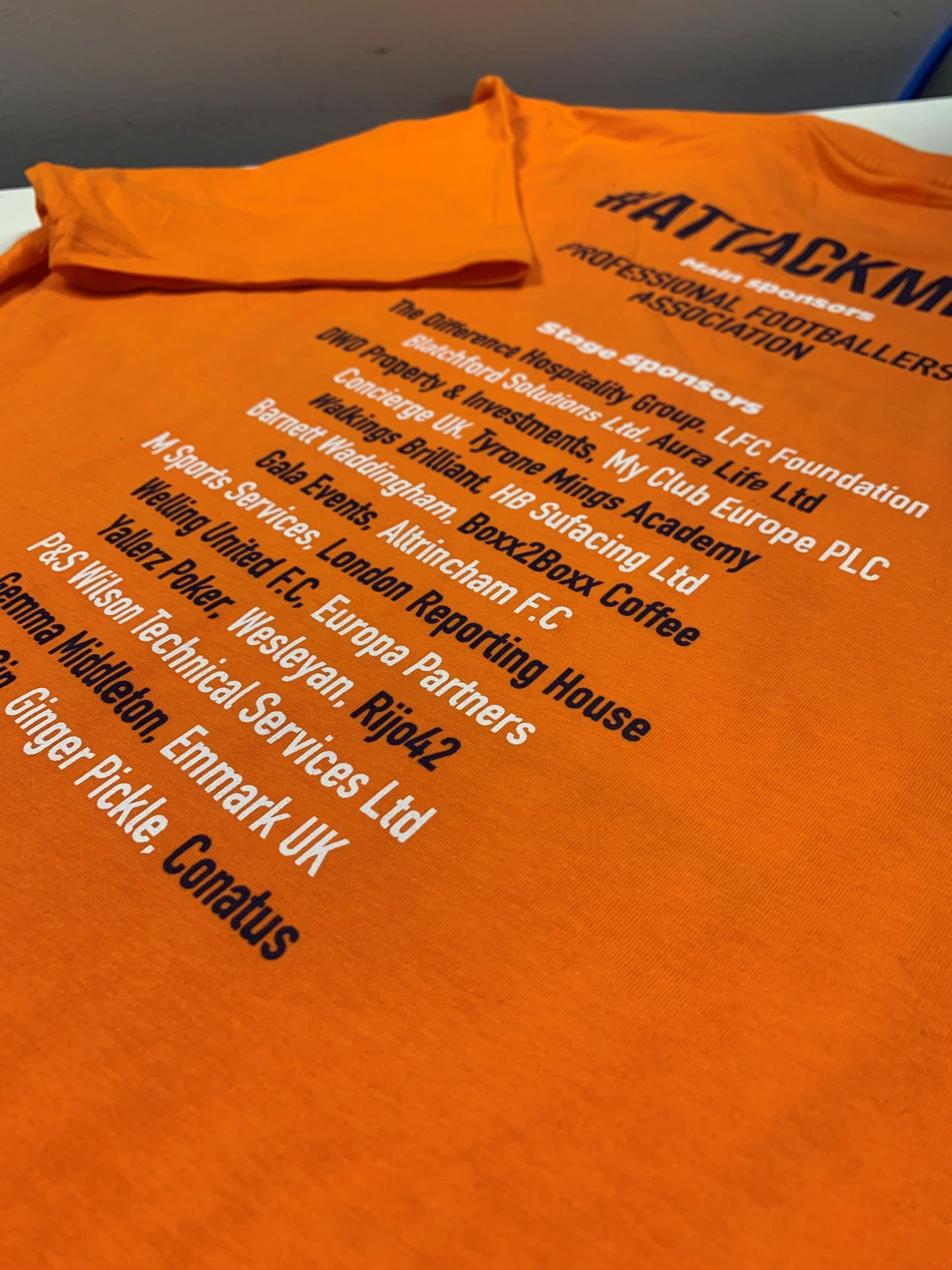 WhiteLodge t-shirt with white text listing sponsors for a professional football association.
