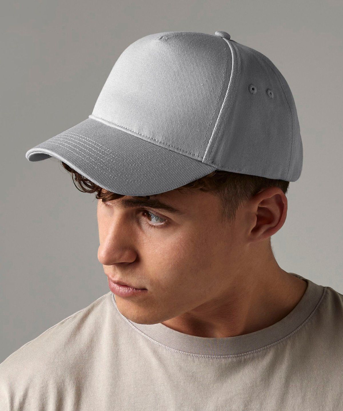 WhiteLodge Man wearing a gray baseball cap, looking off-camera.