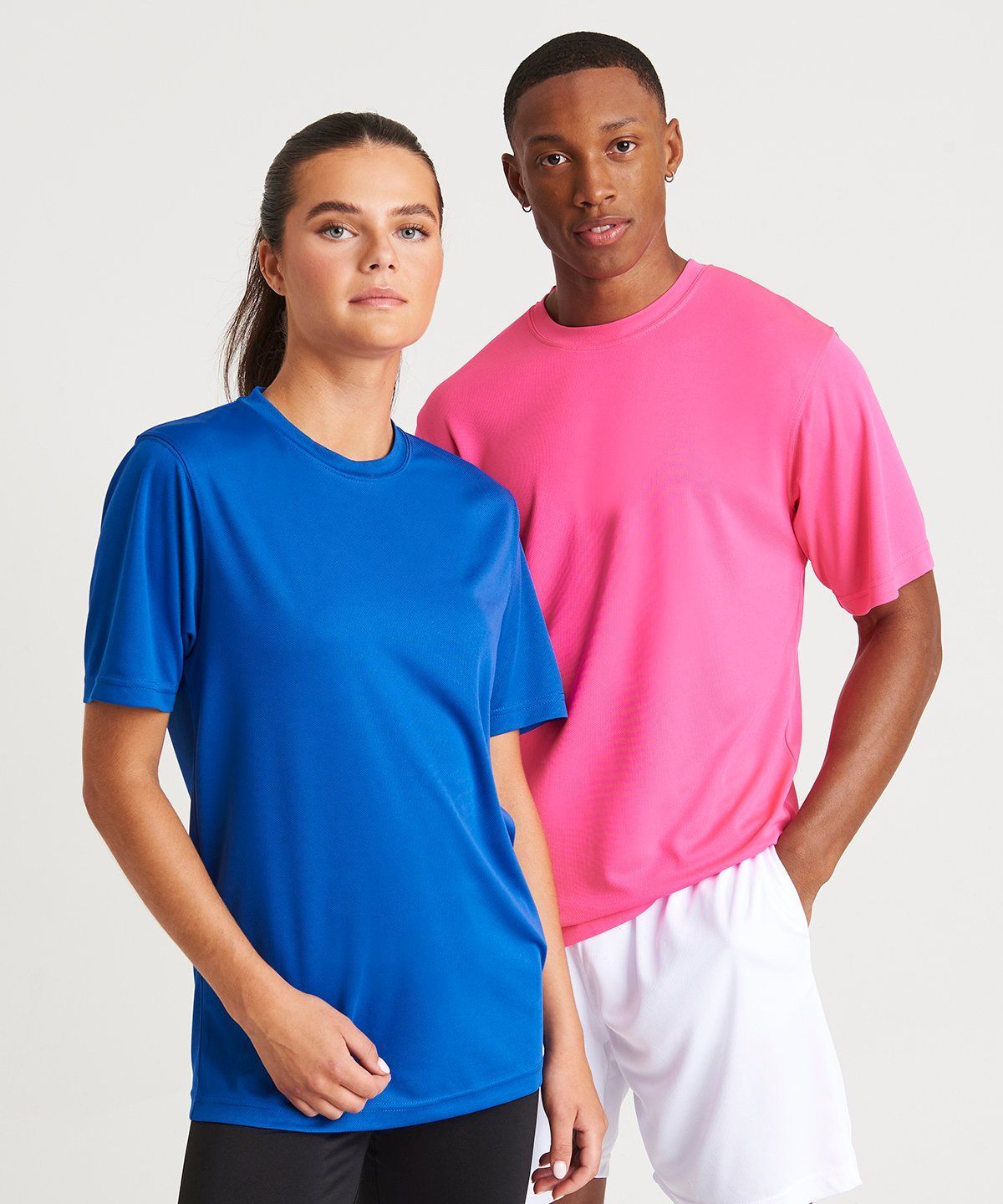 WhiteLodge Woman in blue shirt, man in pink shirt; posing.