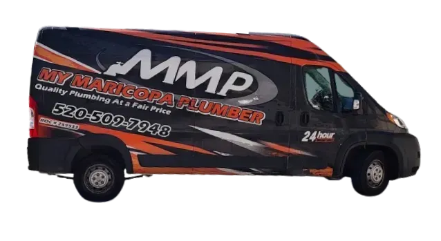 A man with a backpack is standing next to a lake in the woods.