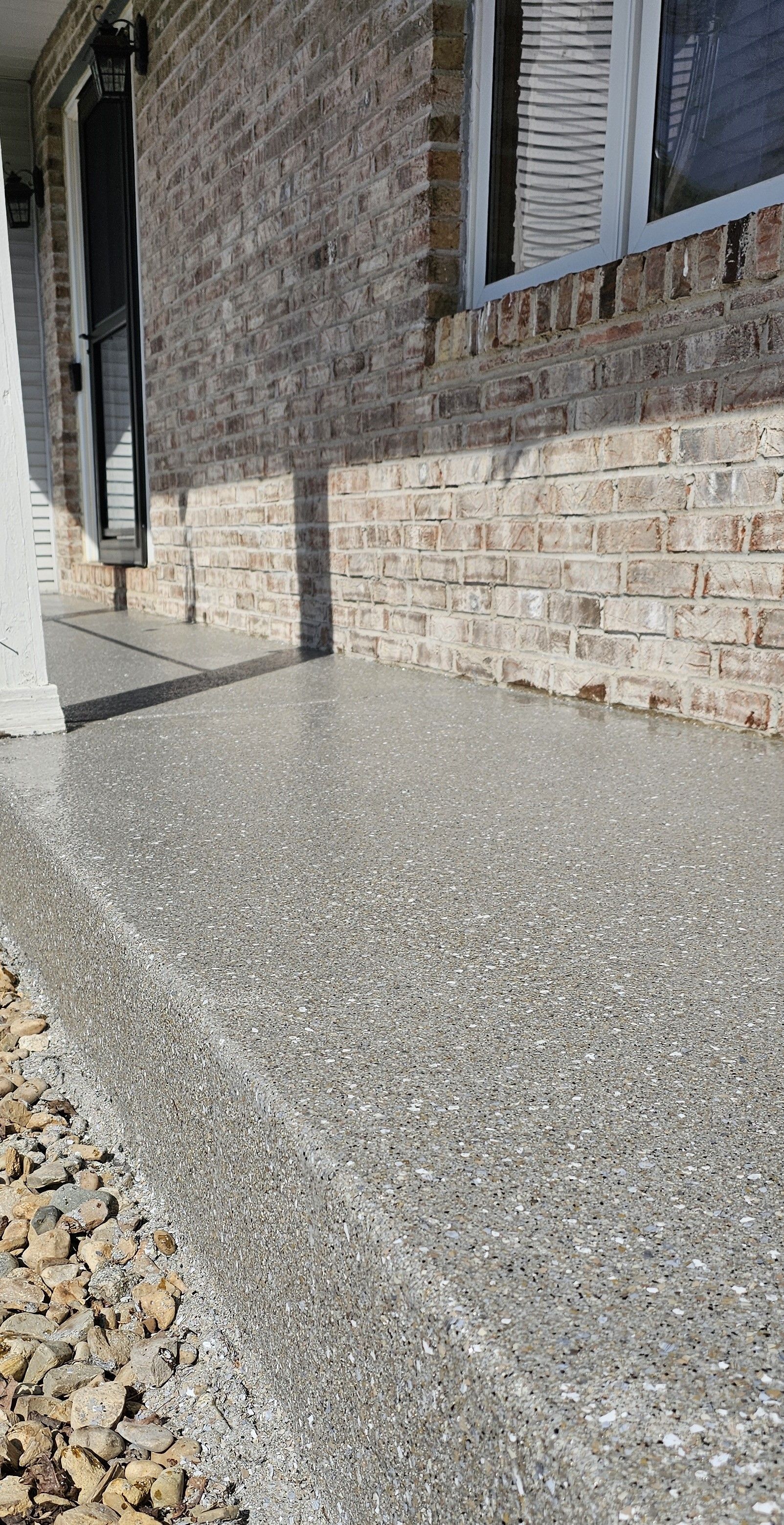 Sidewalk and front porch of house