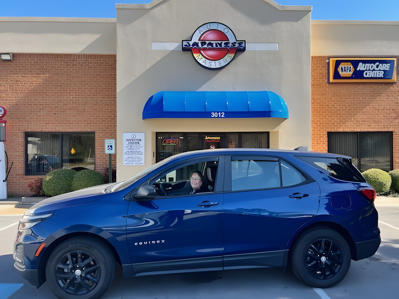 Blue SUV Parked in Front The Shop | Japanese Auto Masters