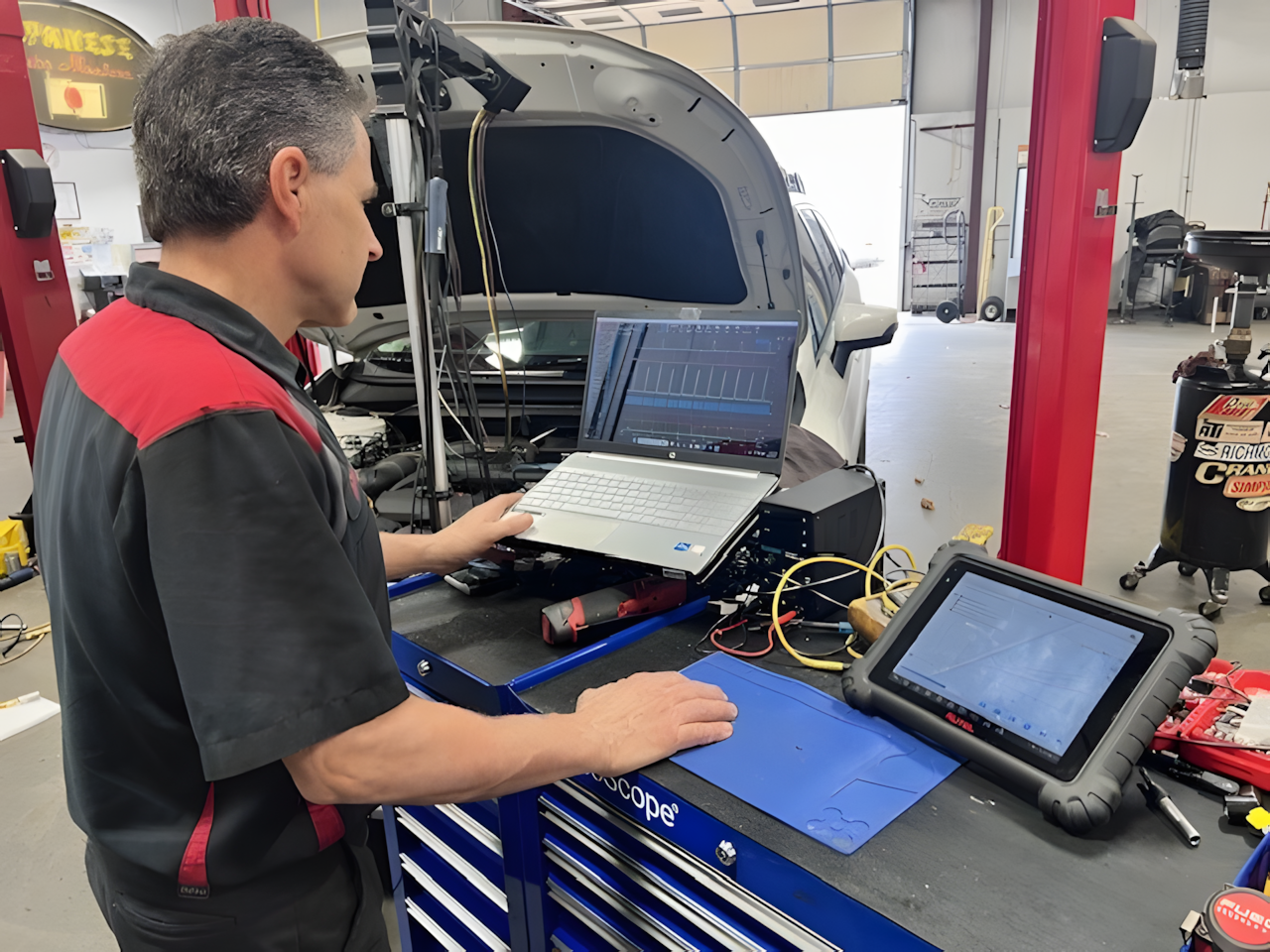 Team Member Uses Diagnostic Tools | Japanese Auto Masters