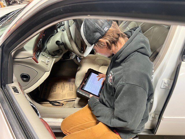 Team Member Diagnosing a Vehicle | Japanese Auto Masters