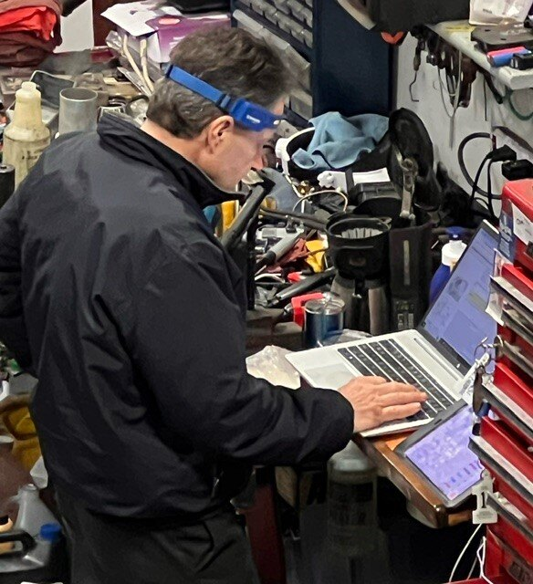 Team Member Working on a Laptop | Japanese Auto Masters