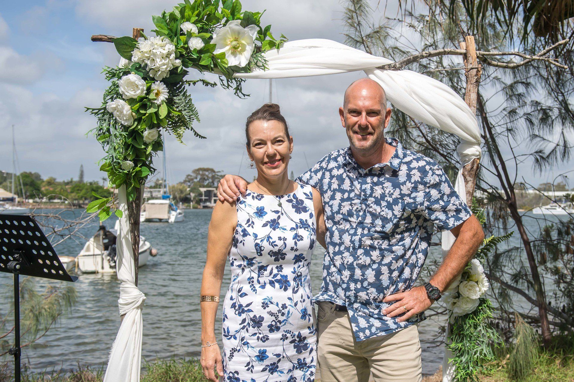 Noosa celebrant and photographer after a wedding both in blue clothes
