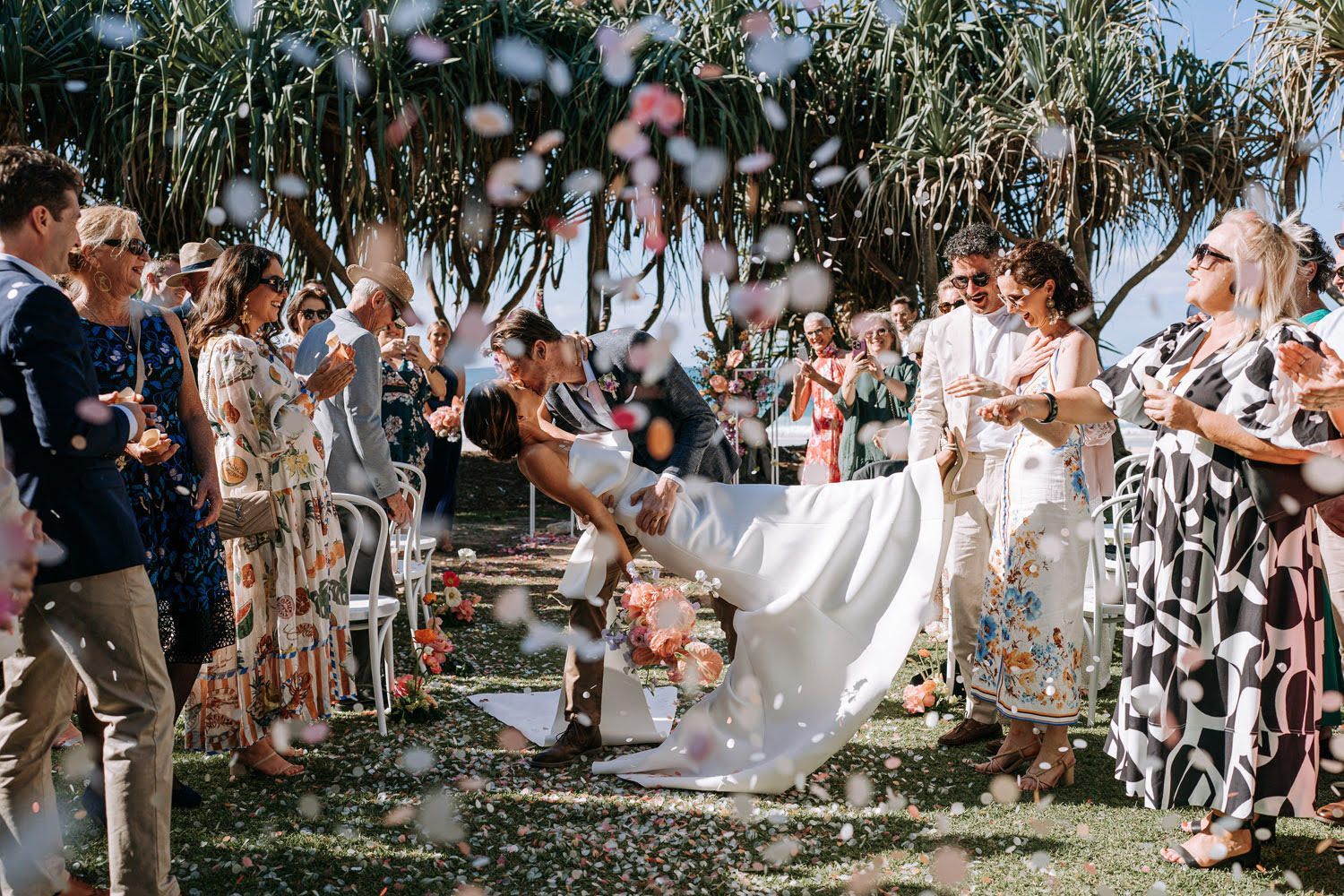Noosa celebrant wedding with confetti and a dip kiss