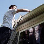 Man Cleaning Gutters — Governor John Sevier Knoxville, Tennessee — Goddard Continuous Guttering