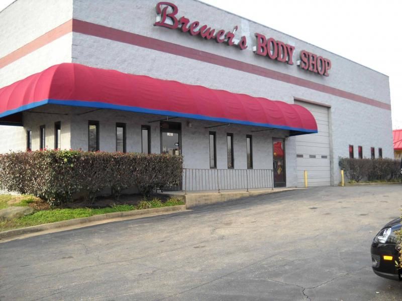 A gray commercial building labeled 