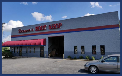 Gray, industrial-style building named Brewer's Body Shop.