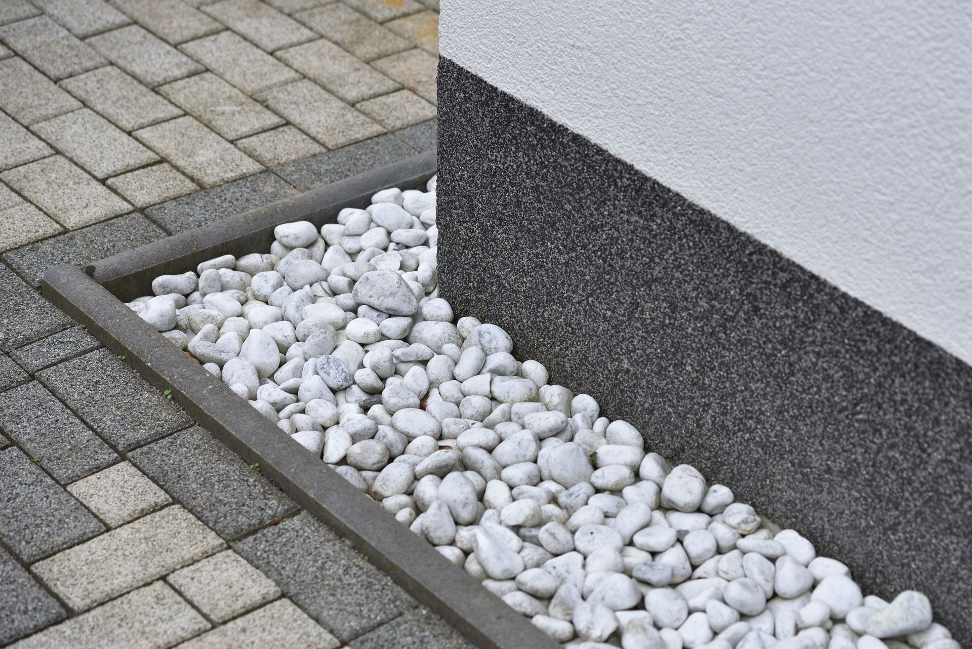 A pile of white rocks on the side of a building.