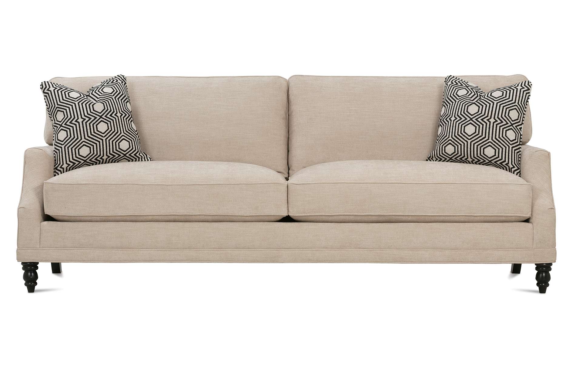 a beige couch with two pillows on it on a white background .