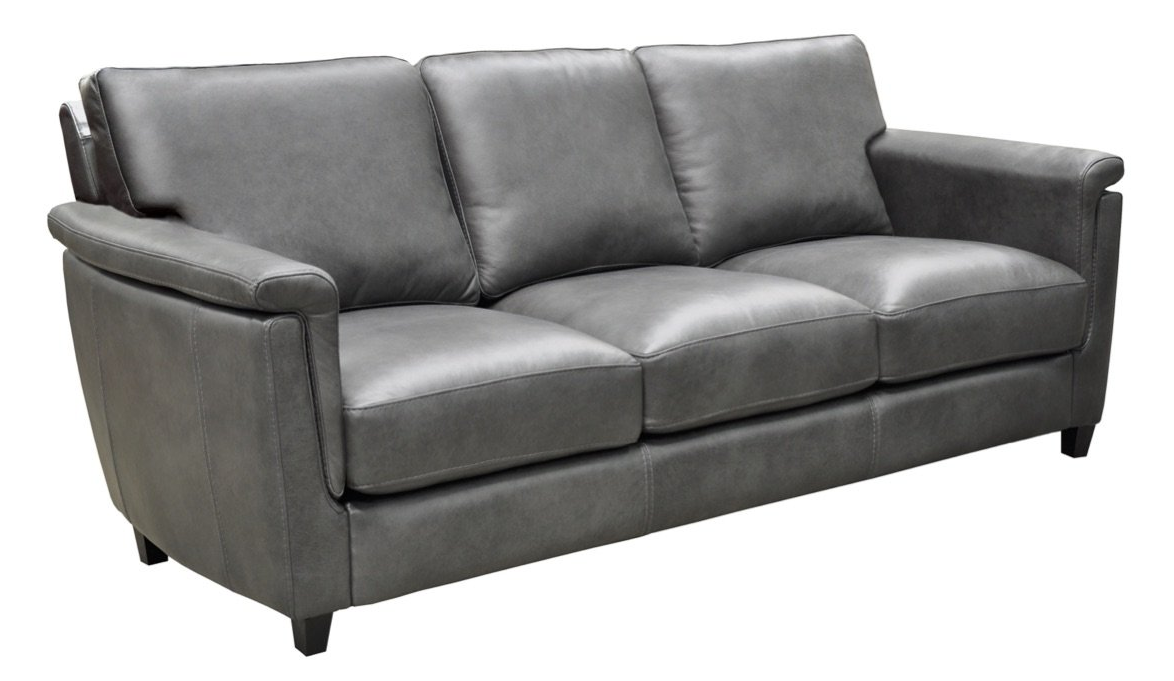 a grey leather couch on a white background