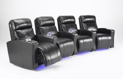 a row of black leather recliner chairs sitting next to each other on a white background .