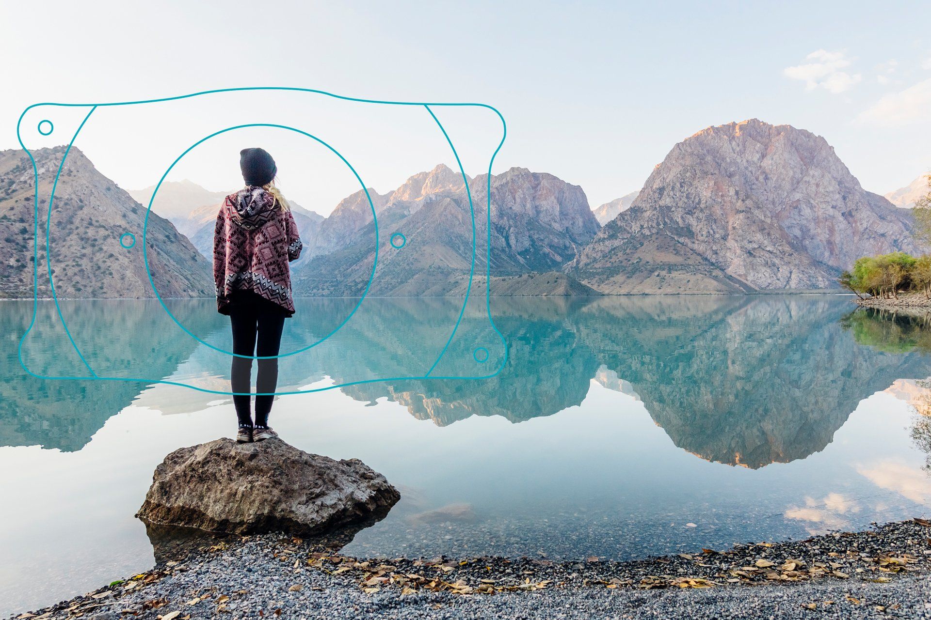 girl standing at the edge of the lake enjoying the view