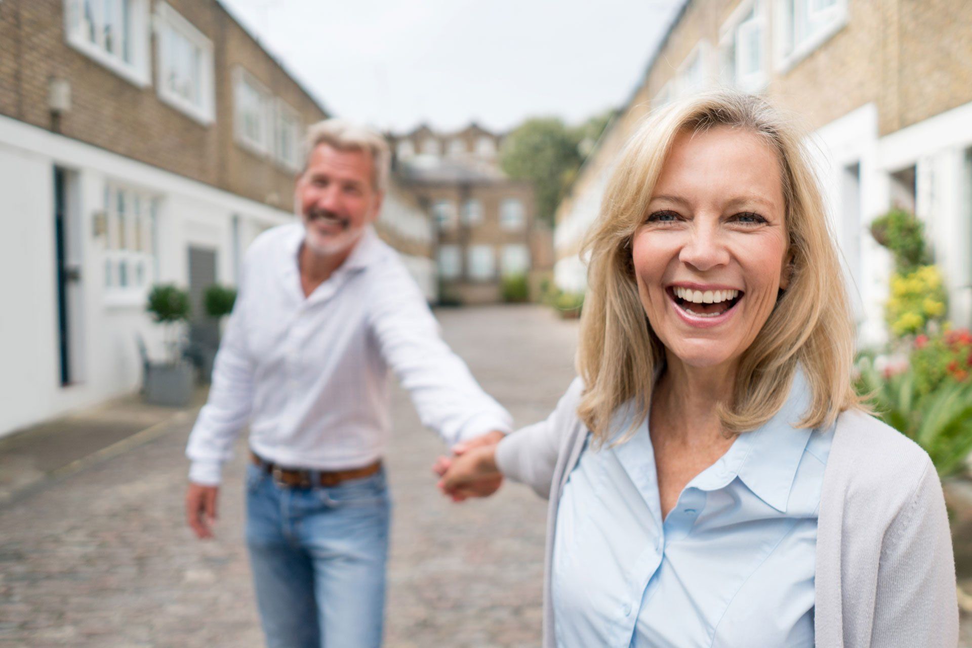 man and woman holding hands
