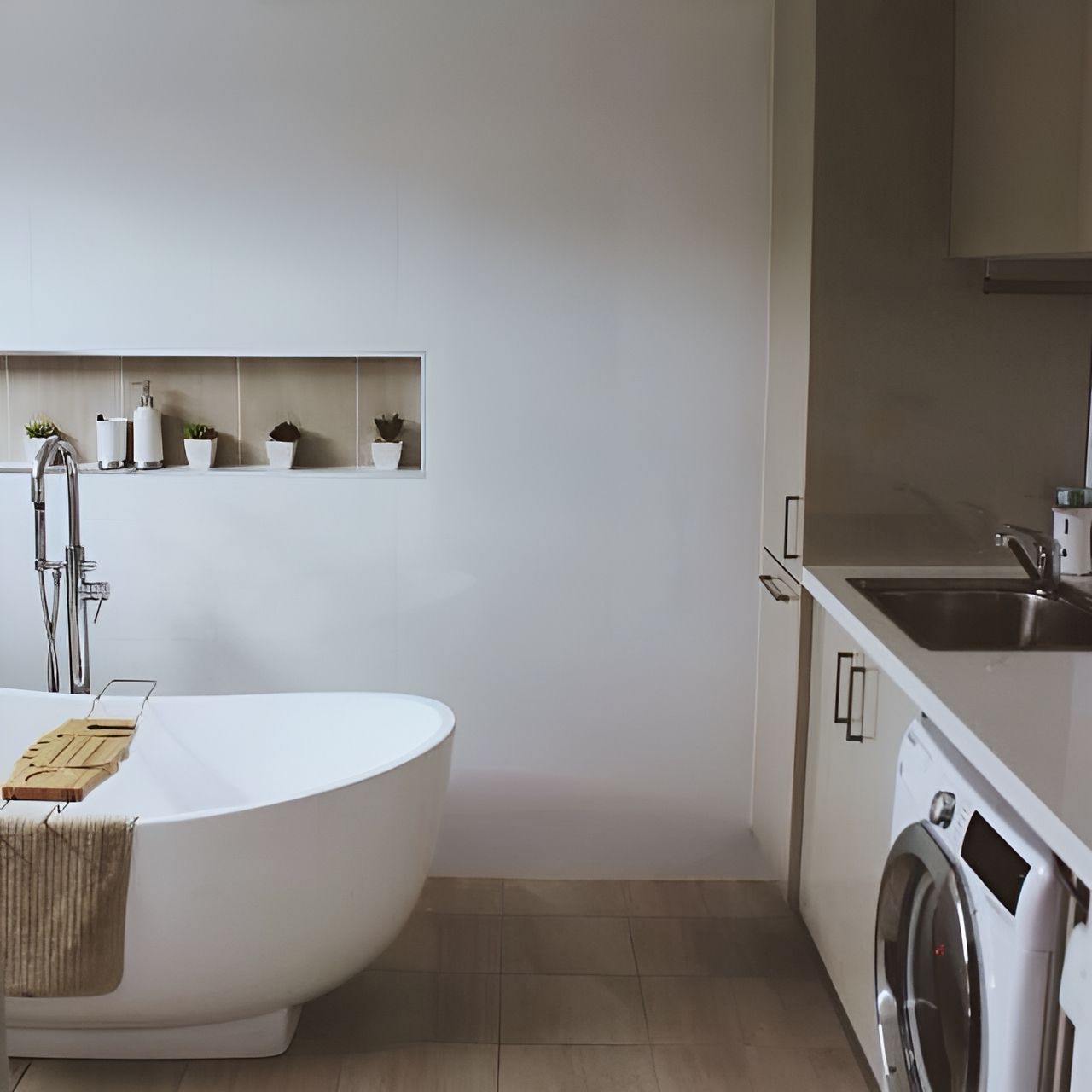A Bathroom With a Bathtub and a Washing Machine — Paiano Custom Kitchens In Corrimal, NSW
