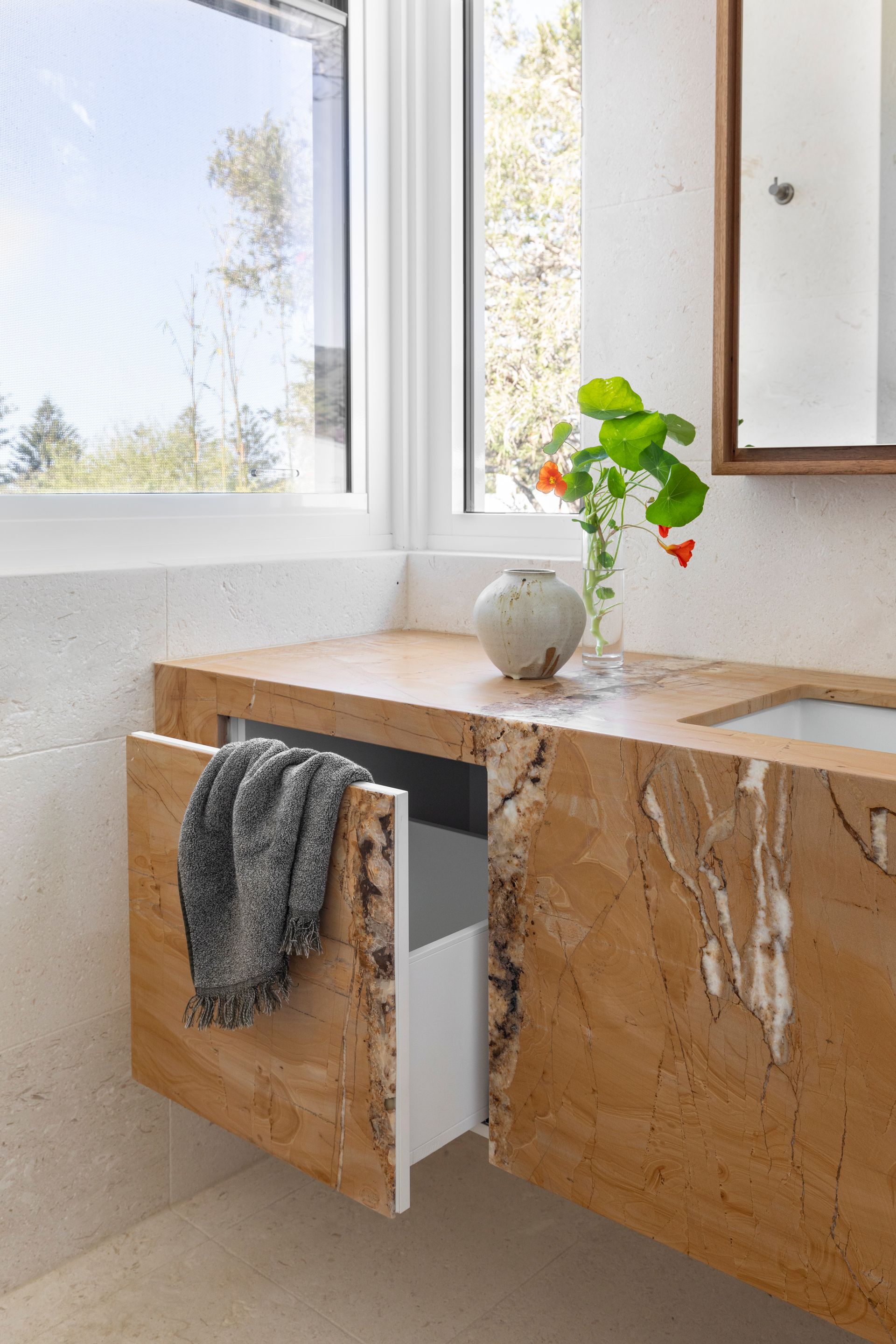 A modern bathroom with drawer open — Paiano Custom Kitchens In Corrimal, NSW