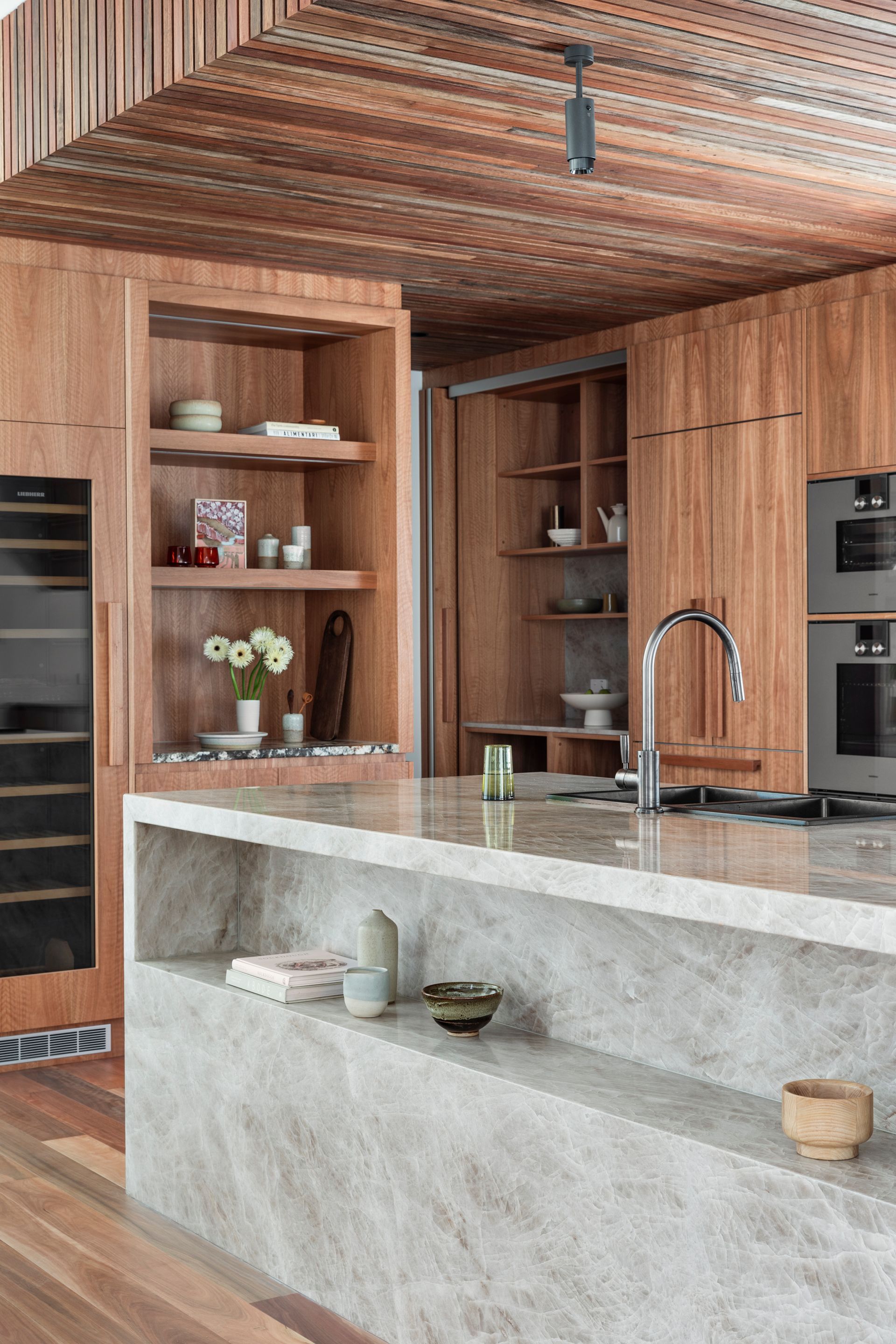 A Kitchen With Wooden Cabinets, and a Large Marble Island — Paiano Custom Kitchens In Corrimal, NSW