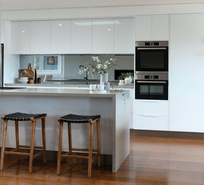 A Kitchen With a Sink and a Large Window — Paiano Custom Kitchens In Corrimal, NSW