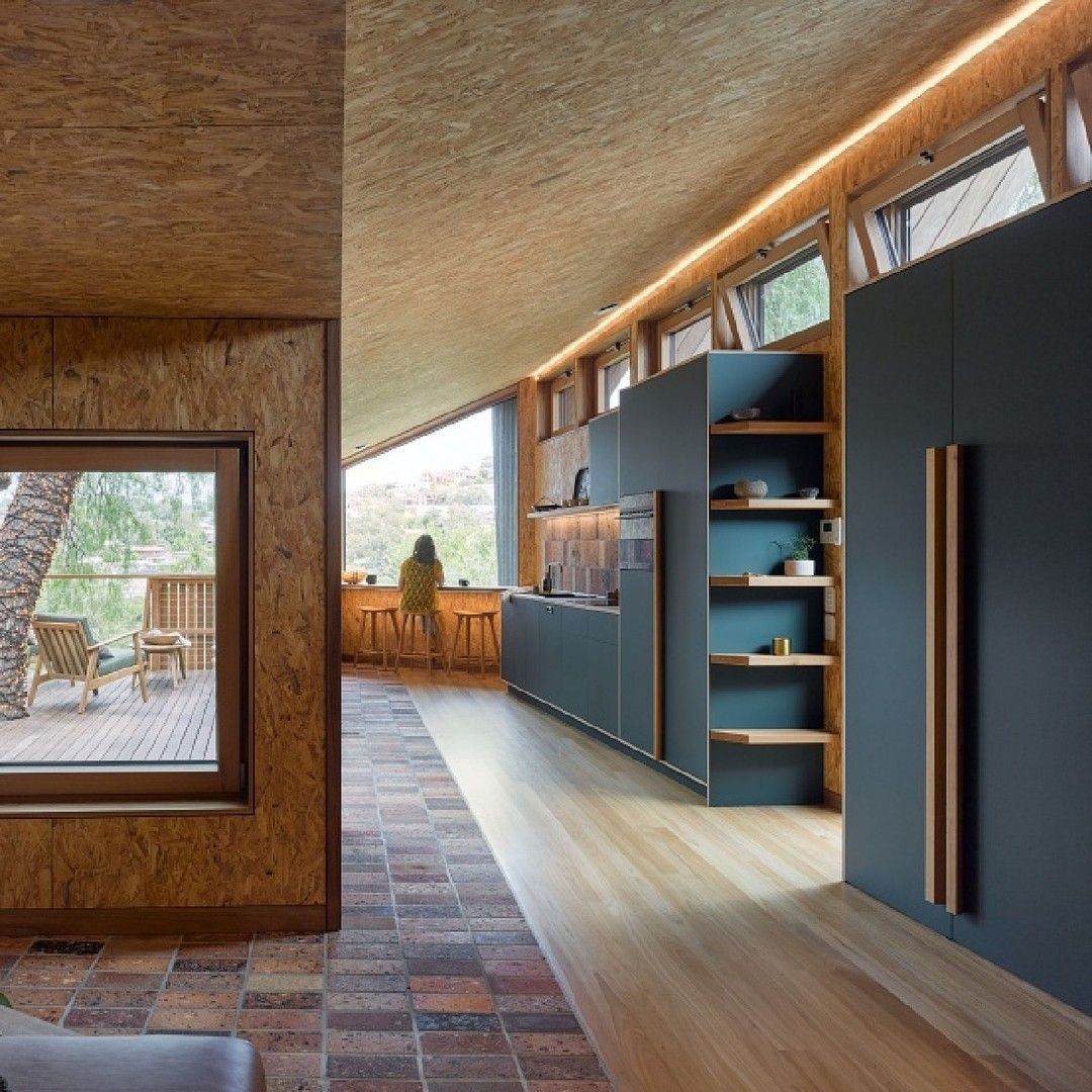 A Kitchen With a Stainless Steel Refrigerator and a Sink — Paiano Custom Kitchens In Corrimal, NSW