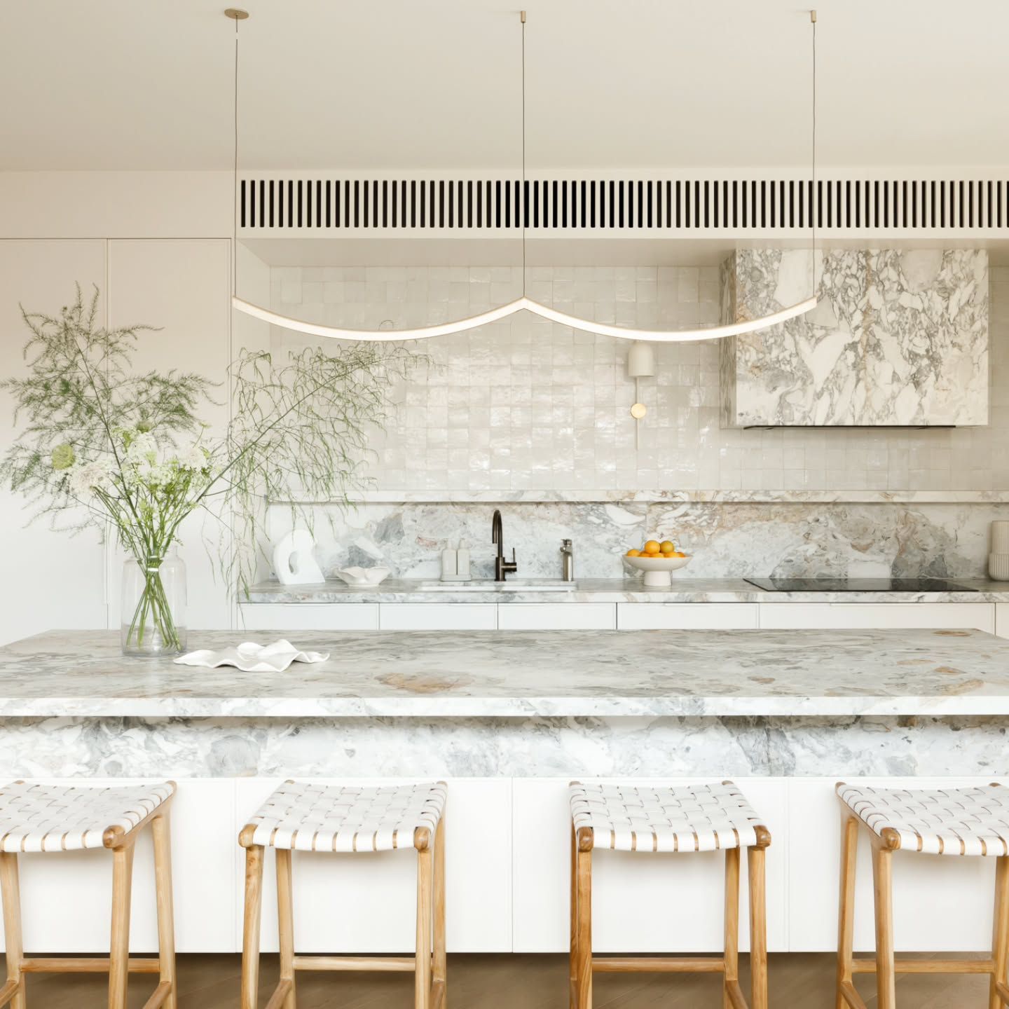 A Kitchen With White Cabinets and Black Tile Floors — Paiano Custom Kitchens In Corrimal, NSW
