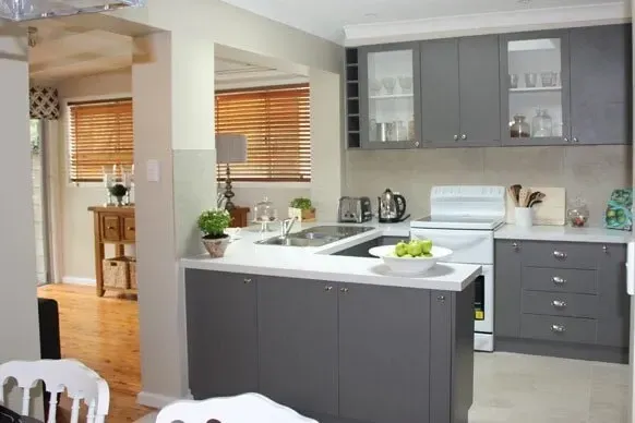 A Kitchen With Gray Cabinets and a White Stove — Paiano Custom Kitchens In Corrimal, NSW