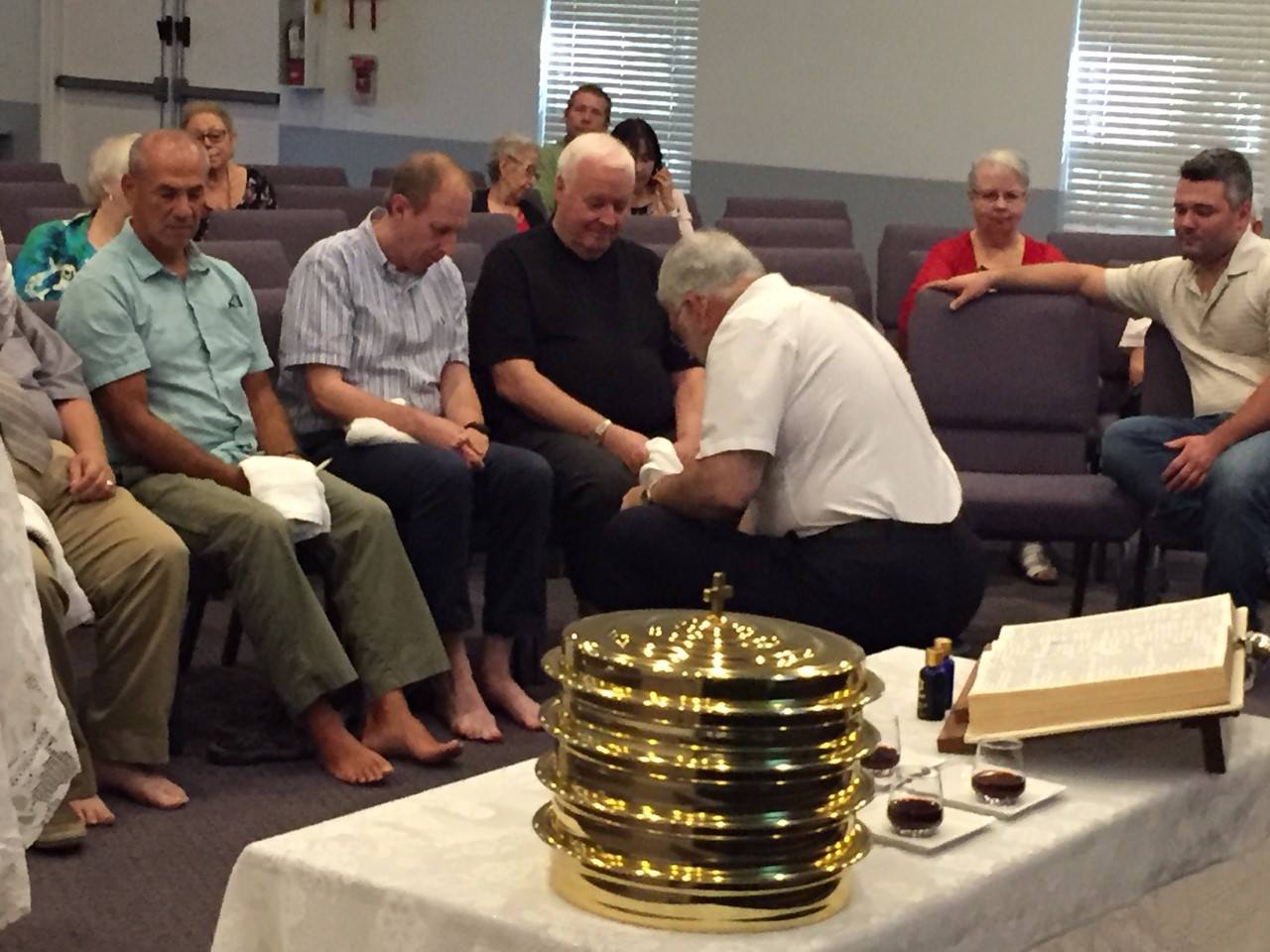 Man Washing The Feet — Naples, FL — Eagle's Nest Worship Center