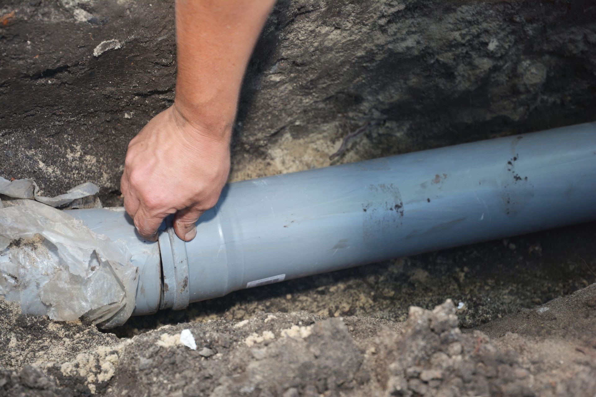 Plumber conducting  pipe inspection with portable camera.