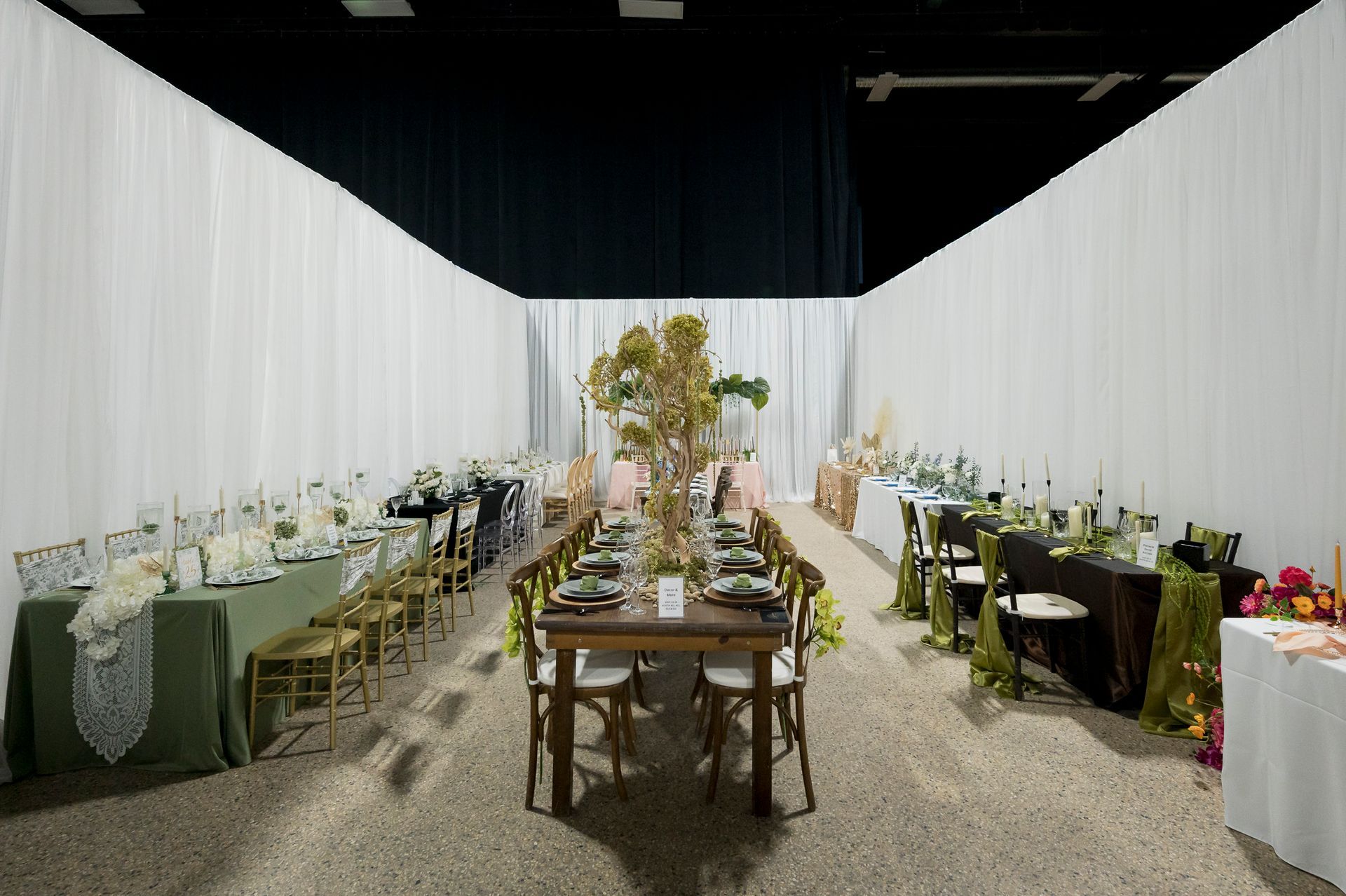 A pink and gold ticket with the words `` buy tickets '' written on it.