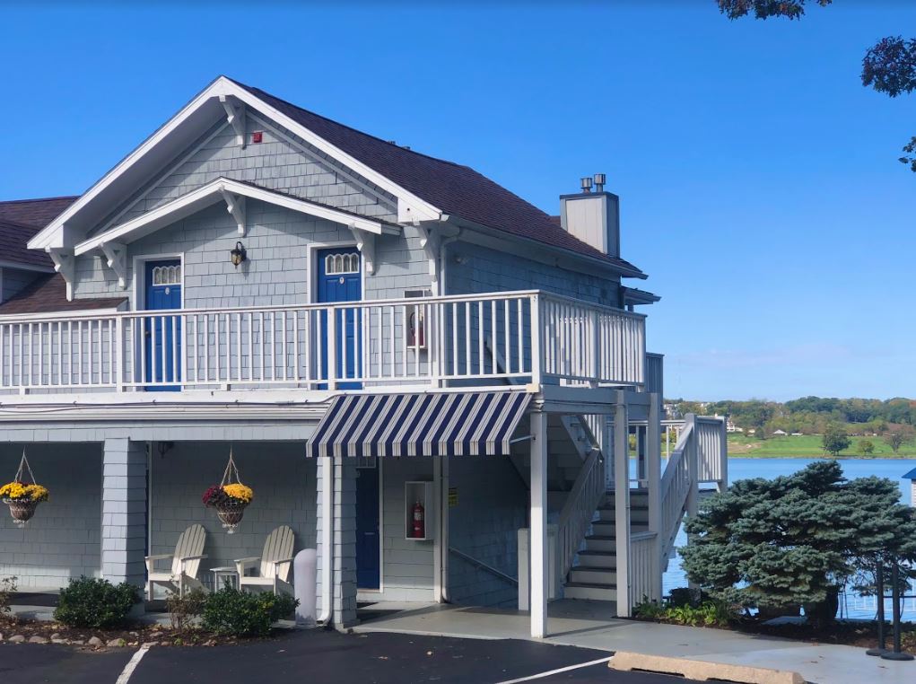 A house with a balcony overlooking a body of water