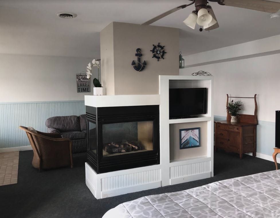 There is a fireplace in the middle of the room.