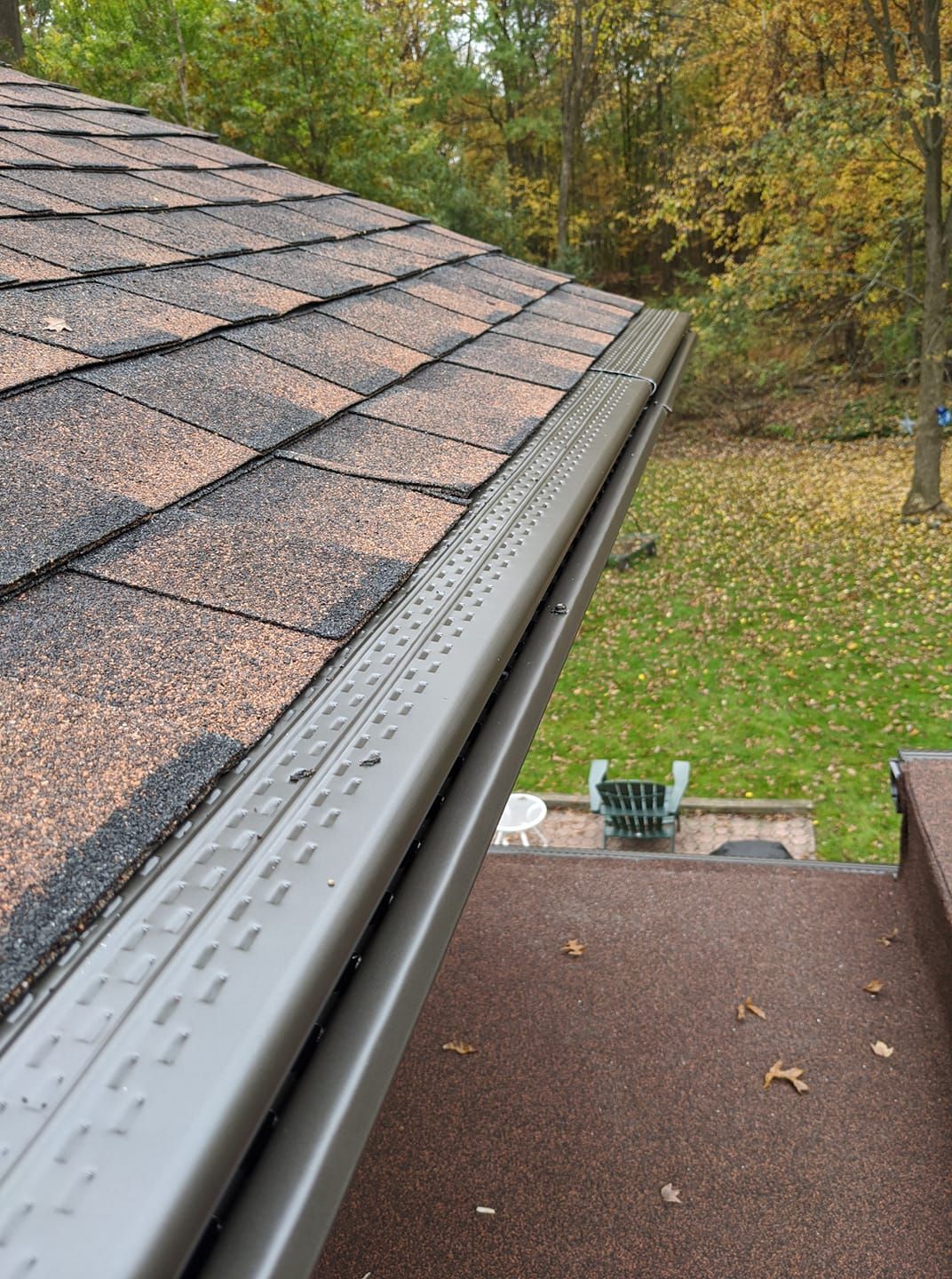 A close up of a gutter on a roof