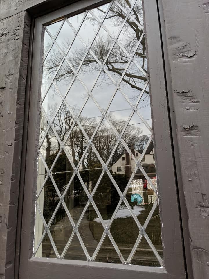 A close up of a stained glass window on a door.