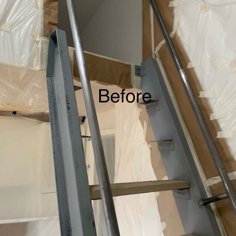 Indoor stairwell under renovation, with plastic sheeting, exposed stairs, and “Before” text overlay.