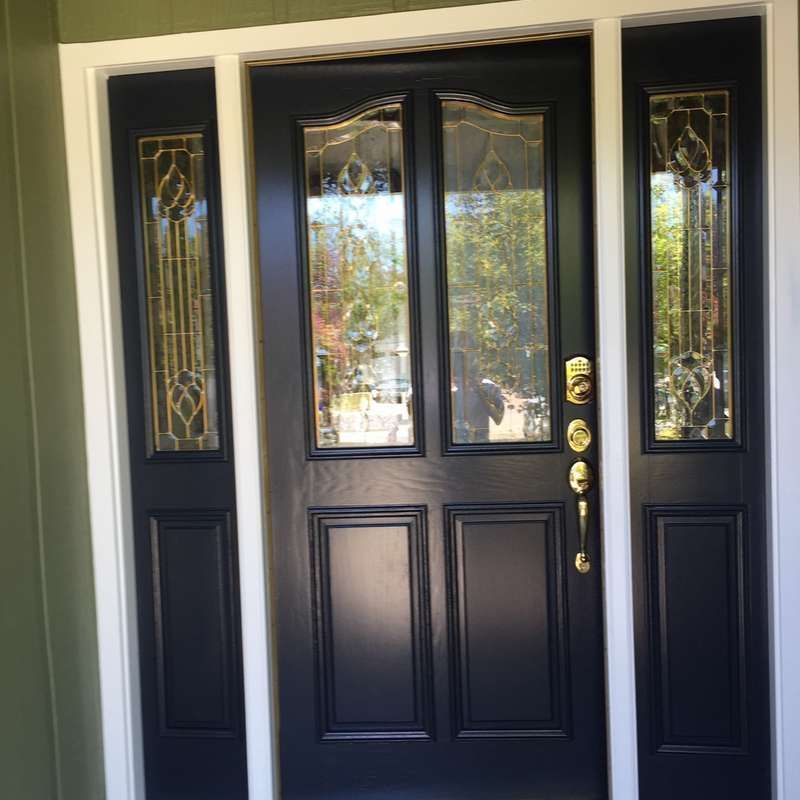 Black double front door with sidelights and decorative glass panels