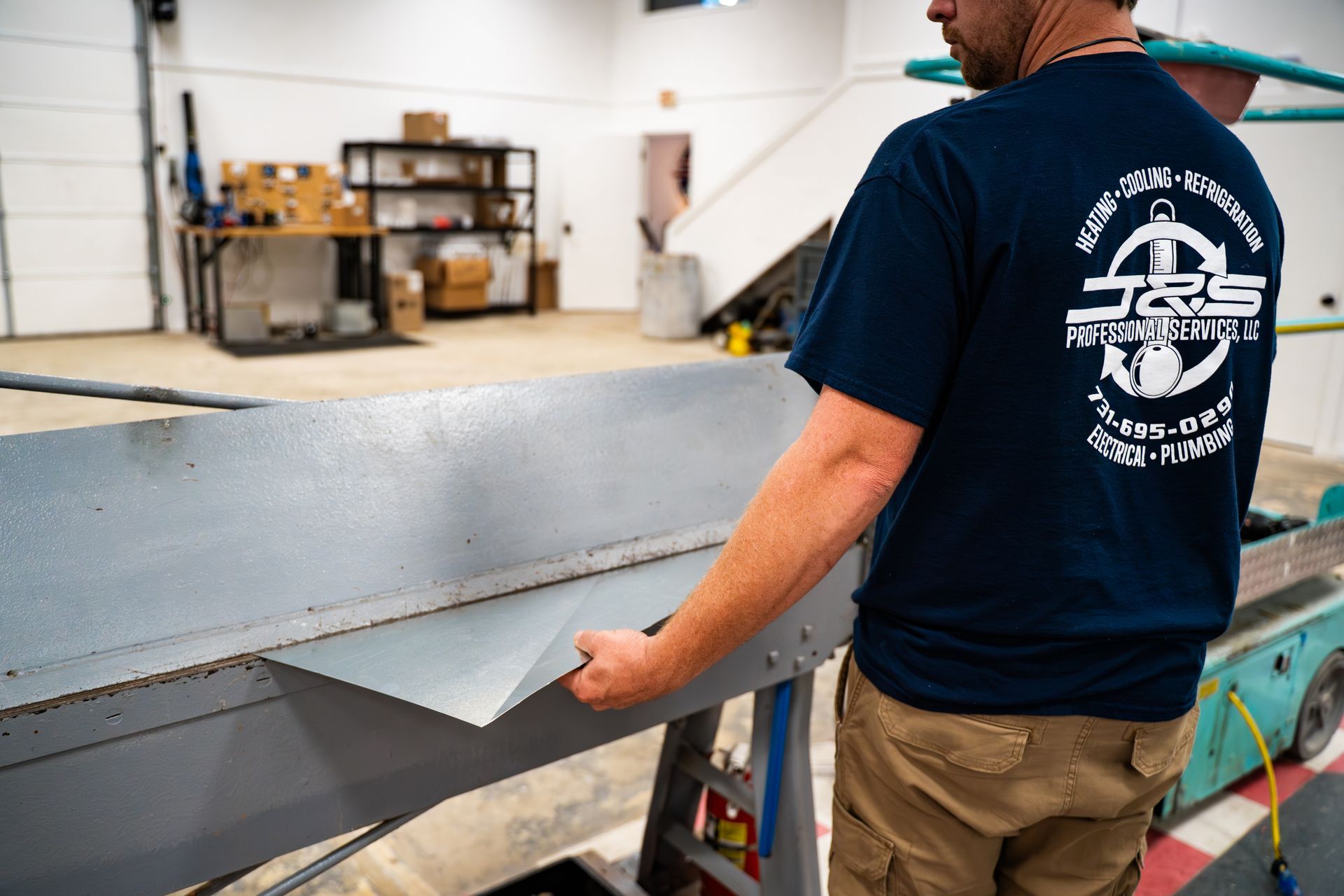 A machine is cutting a piece of metal with a laser.