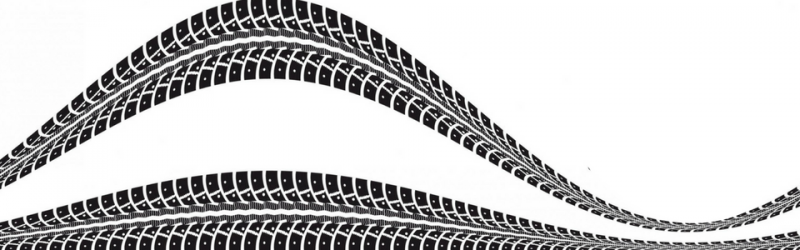 Black tire tracks on a white background.